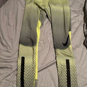Nike yellow and black compression training pants.